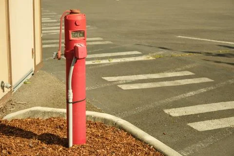 A red fire hydrant is in the frame. Stock Photos