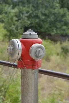Red fire hydrant head on a metal pole Stock Photos
