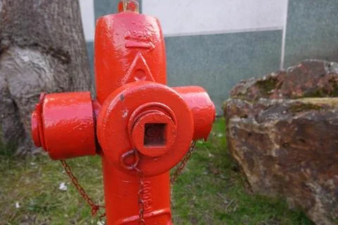 Red fire hydrant providing emergency water supply Stock Photos