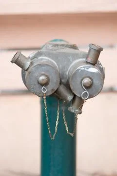 Red fire hydrant on a sidewalk Stock Photos