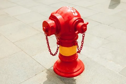Red fire hydrant on the street Stock Photos