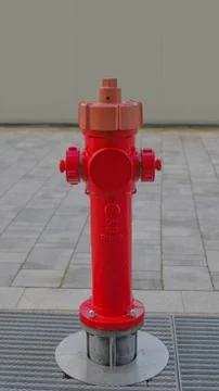 Red fire hydrant on the street Stock Photos