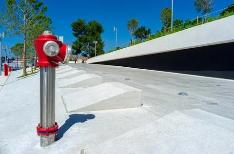 Red fire hydrant in the street Stock Photos