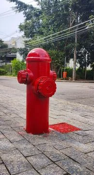 Red fire hydrant on the street sidewalk Stock Photos