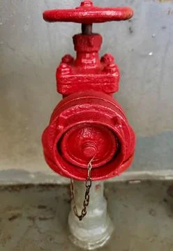 Red Fire Hydrant Valve on Ship Deck. Maritime Fire Safety Equipment Stock Photos