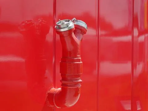 Red fire hydrant at wall Fotos Stock