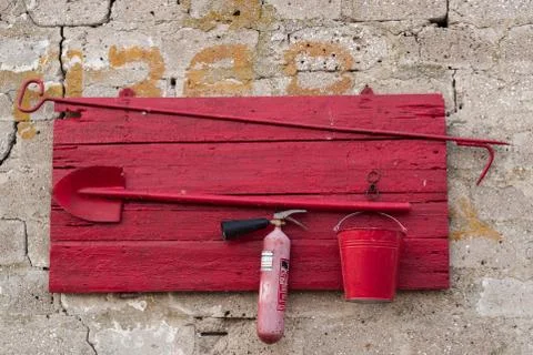 Red fire shield on a stone wall Stock Photos