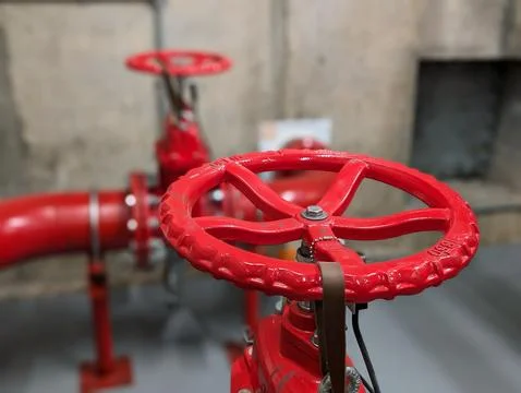 Red Fire Sprinkler Control Valve in Commercial Fire Protection System Stock Photos