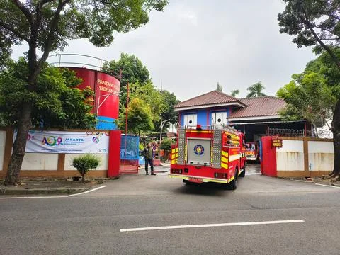 Red fire truck returned to the fire department in Kalibata, Jakarta. Stock Photos