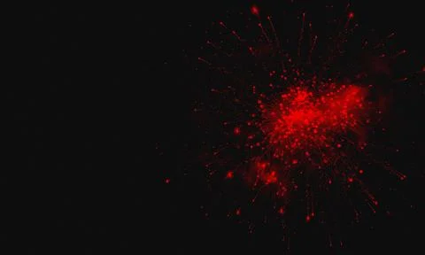 Red Firework Explosion Illuminating Dark Night Sky Foto stock