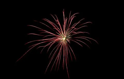 An red firework explosion in the night sky Stock Photos