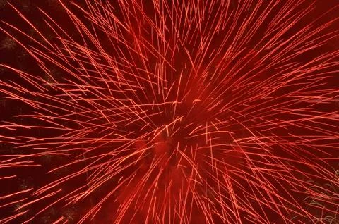 Red firework in night sky Stock Photos