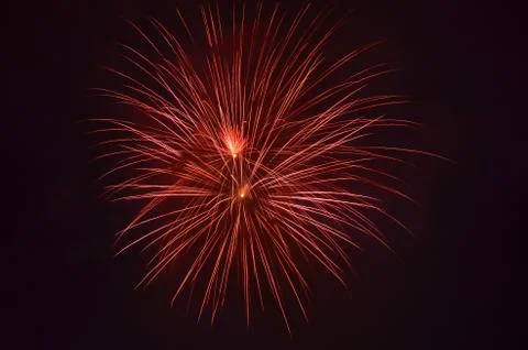 Red firework in night sky Stock Photos