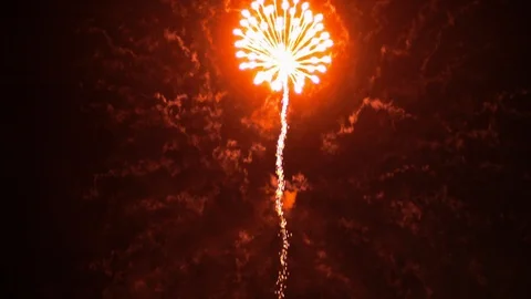 Red Firework Shooting into Sky and Exploding TILT UP 動画素材 107277560