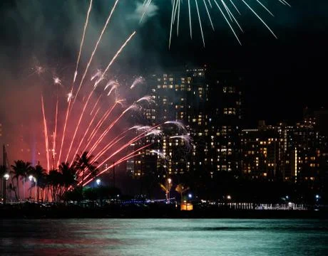 Red Fireworks with Blue Reflection Stock Photos