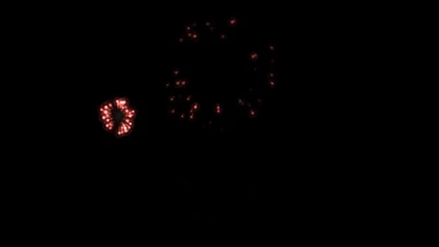 Red Fireworks Bursting on Black Background Stock Footage 341294019