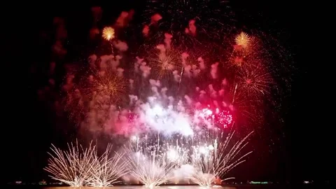 Red Fireworks Display Exploding Over Dark Night Sky Video stock 329616081