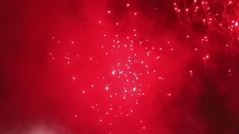 Red Fireworks Exploding in Night Sky During Diwali Celebration Festival of L Stock Footage 320317998