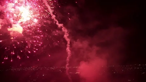 Red fireworks exploding in night sky with heavy smoke Stock Footage 337057873