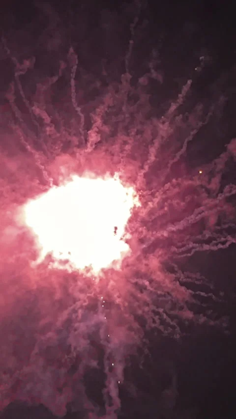 Red Fireworks Exploding in Night Sky Close Up Stockbeeldmateriaal 347745981