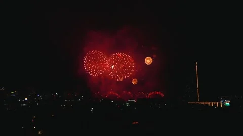 Red Fireworks Explosion Over Night City Skyline. International Fireworks Stock Footage 343043029