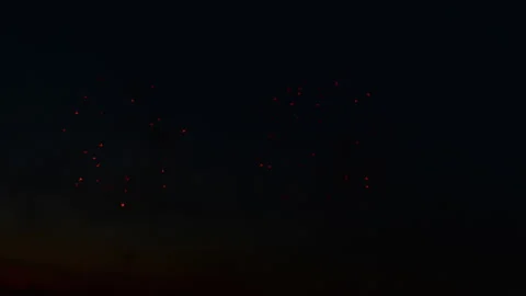 Red fireworks in night sky Video stock 252134497