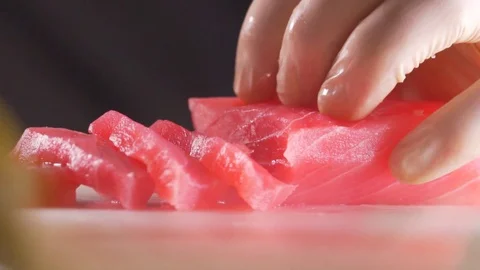 Red fish is cooked by a cook Stock Footage 83346277