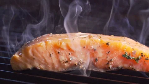 Red fish is cooked by a cook Stock Footage 83346723