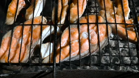 Red fish is fried on coals Stock Footage 68350174