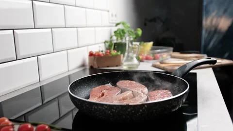 Red Fish Salmon Frying In A Pan On The Kitchen Stove Stock Footage 338355448