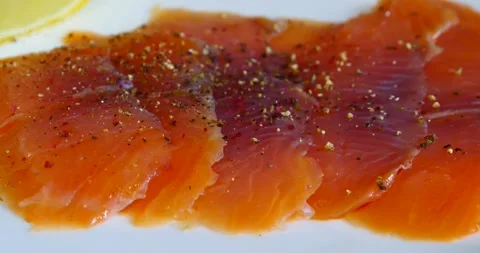 Red fish on a white dish with lemon Stock Footage 141946026