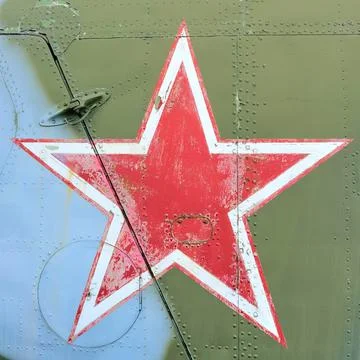 Red five-pointed star aboard a military aircraft Stock Photos