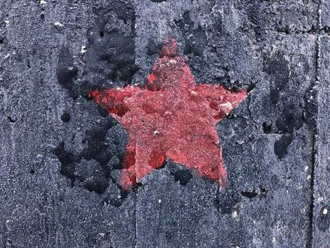 Red five-pointed star on a black Stock Photos