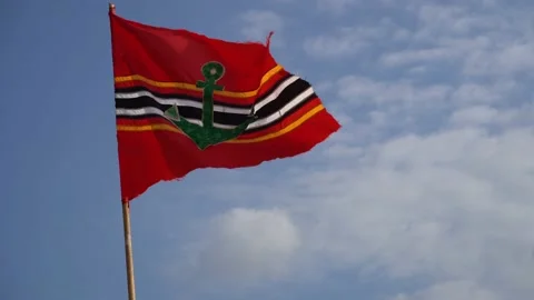 Red Flag with anchor blowing in the wind at the beach in Bali, Indonesia. Stock Footage 131340760