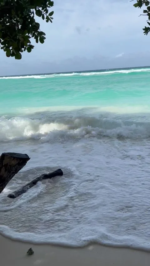 Red flag and waves on Silhouette island, Seychelles Stock Footage 241063050