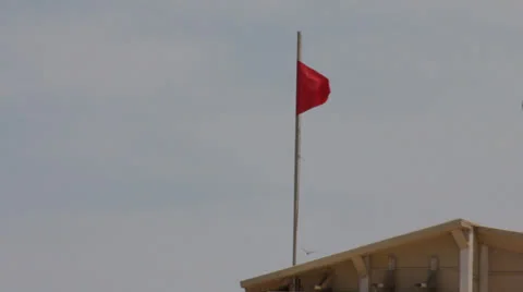 Red flag on beach 4 Stock Footage 22759564