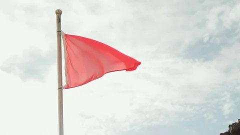Red flag on the beach means danger swimming is forbidden Vídeos de archivo 72964513