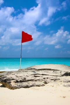 Red flag on the beach Stock Photos