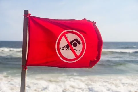 Red flag at the beach Stock Photos