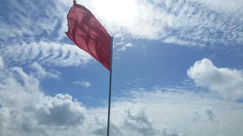 Red Flag on Beach Stock Photos