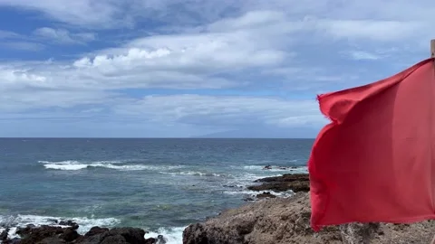 The red flag at the beach to remind people not to swim in the sea. 4K. Stock Footage 196880016