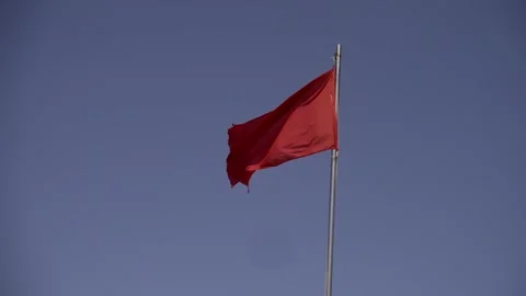 Red flag on beach signaling danger for swimming Stock Footage 283301375