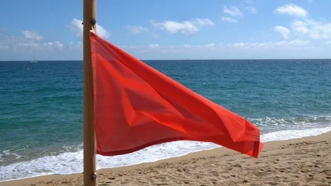 Red flag on the beach warned of the danger. No swimming in the sea, ocean - no l Stock-Footage 113100842