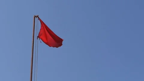 Red flag on the beach warned of the danger. Video stock 115069497