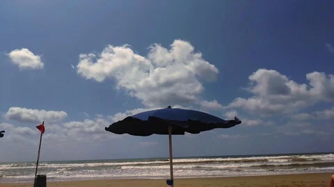 Red flag on the beach in a windy day, Italy Stock Footage 115185732