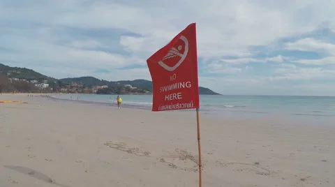  Red Flag on The Beachv -Phuket, Kata Beach, Thailand  Stock Footage 64921015