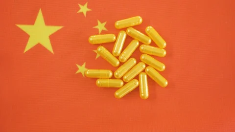 The red flag of China with the yellow capsules on top Stock Footage 129343295