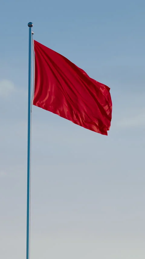 Red Flag: Cinematic Vertical Waving Flag Against Blue Sky Stock Footage 322569063