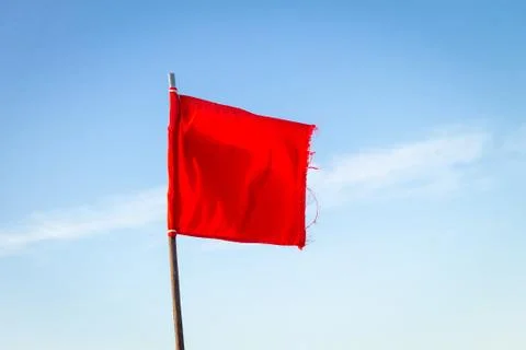 Red Flag on Clear Day Stock Photos