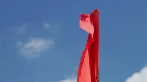The red flag of danger on the beach Stock Footage 37592335